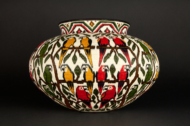 red green yellow parrots basket